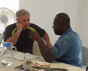 Dr. Steve Edmondson speaks with Haiti's former national director of finance.  (Image courtesy Starfysh)