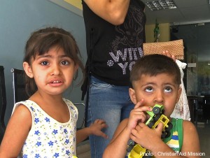 Two of the many children in Syria who have seen the horrors of war take comfort in weekly Christian programs, and they find trustworthy friends in the volunteers who organize activities with the help of local churches.  (Photo, caption courtesy Christian Aid Mission)