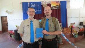 MAF staff, Dave LePoidevin and Dave Holmes, holding a copy of the Takwane Bible. (Caption and Photo courtesy of MAF)