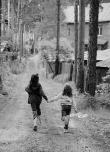 https://unsplash.com/photos/two-children-running-down-a-dirt-road-holding-hands-v1mqLi8S9EQ